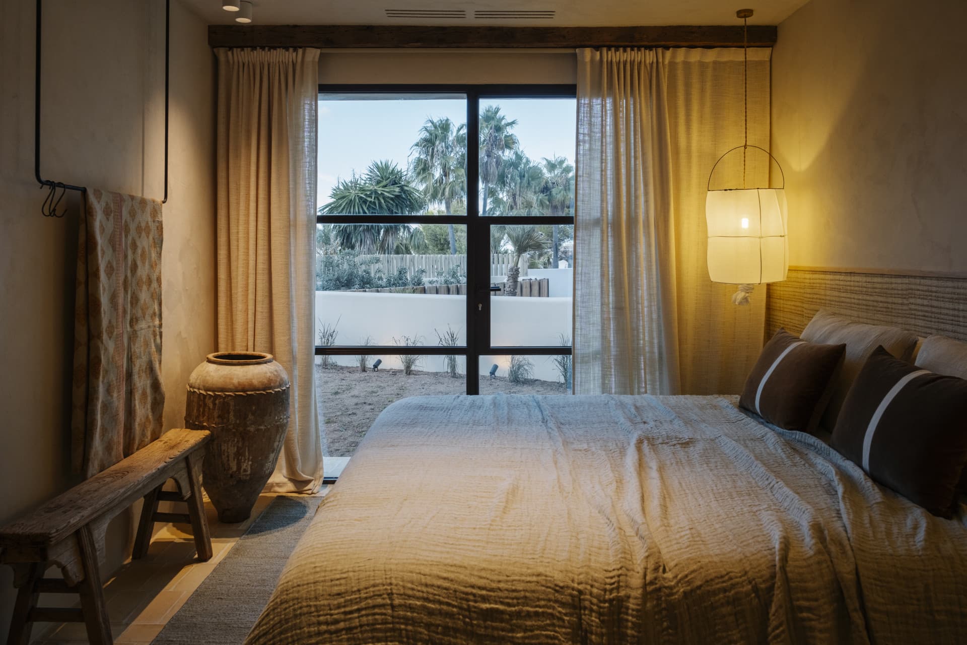 Casa Garrofer features four bedrooms with en-suite bathrooms and a guest toilet, including an independent apartment with a private garden complete with a charming Alberca, a fountain-style pool. - 16