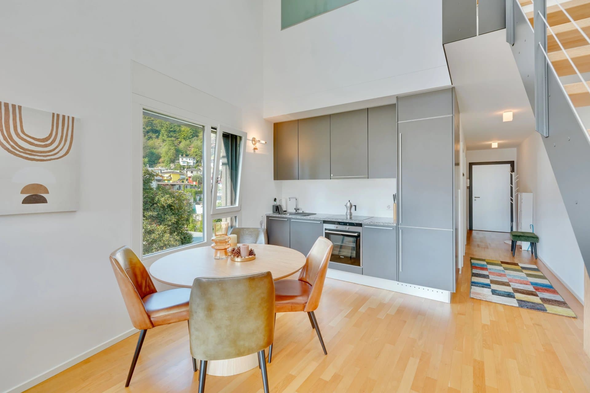 This modern duplex apartment, with a beautiful, covered terrace and secondary residence status, is for sale in Losone, in a peaceful residential area within a building with only a few units. - 4